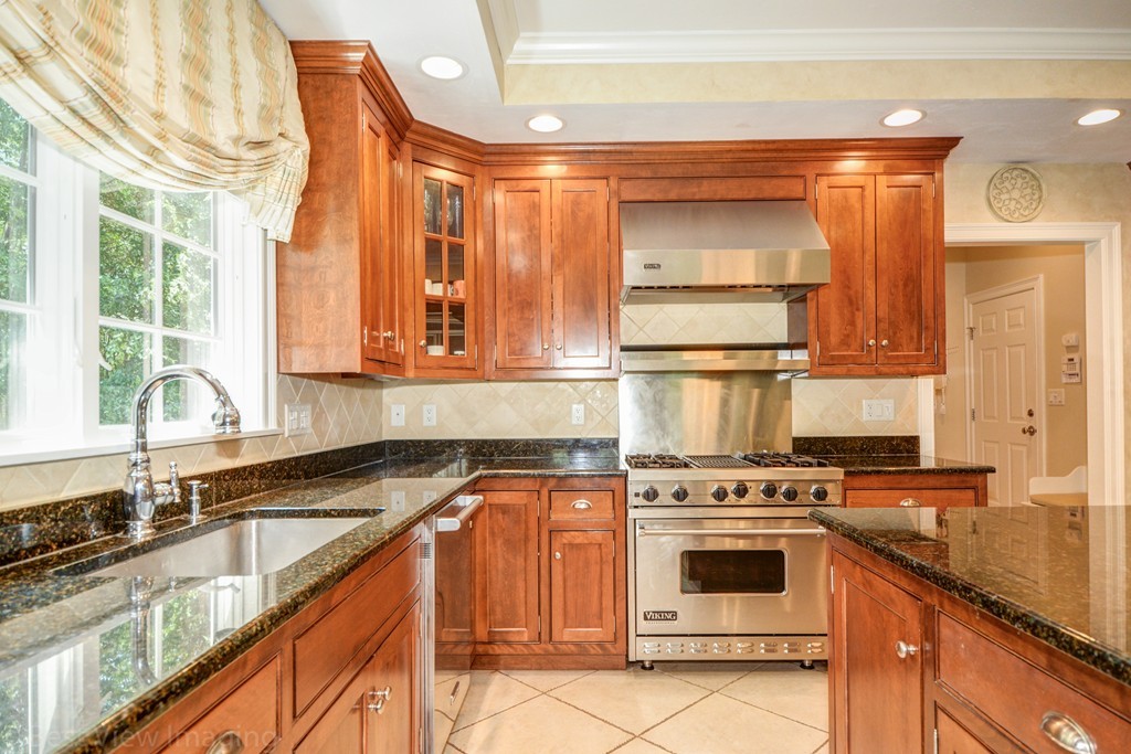 29 Prospect Street Upton, MA 01568 - Photo 11 of 30 a kitchen with a stove a sink and a microwave
