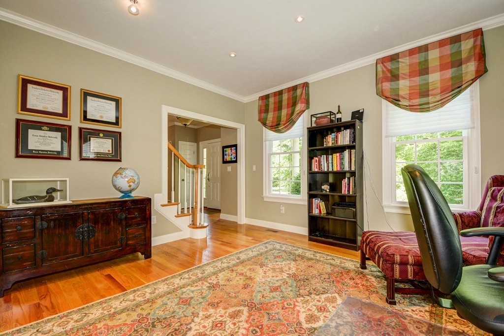 29 Prospect Street Upton, MA 01568 - Photo 14 of 30 a spacious bedroom with a bed a dresser and bookshelf