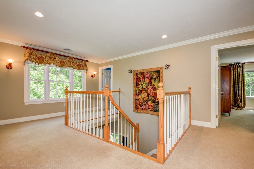 29 Prospect Street Upton, MA 01568 - Photo 19 of 30 a view of a hallway with windows and stairs