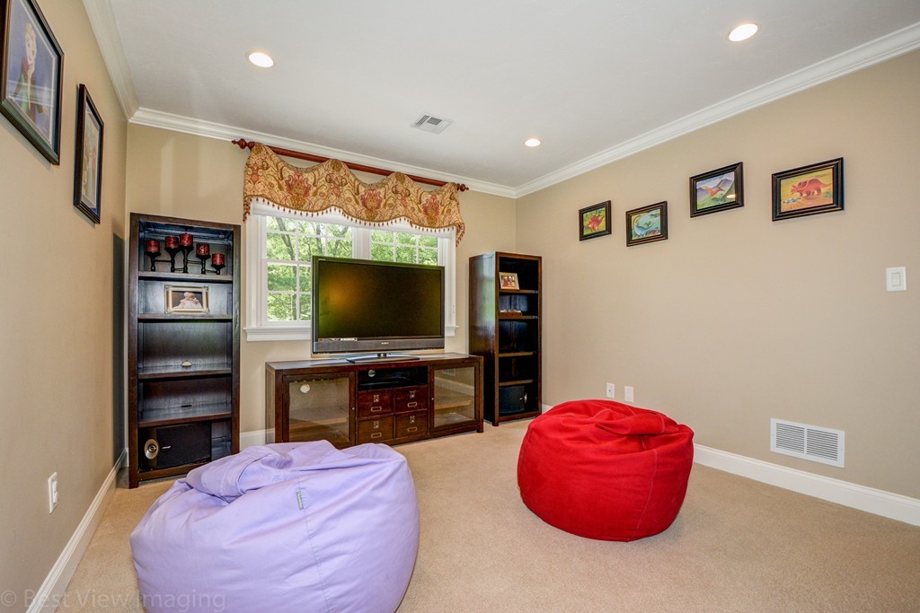 29 Prospect Street Upton, MA 01568 - Photo 20 of 30 a living room with furniture and a flat screen tv
