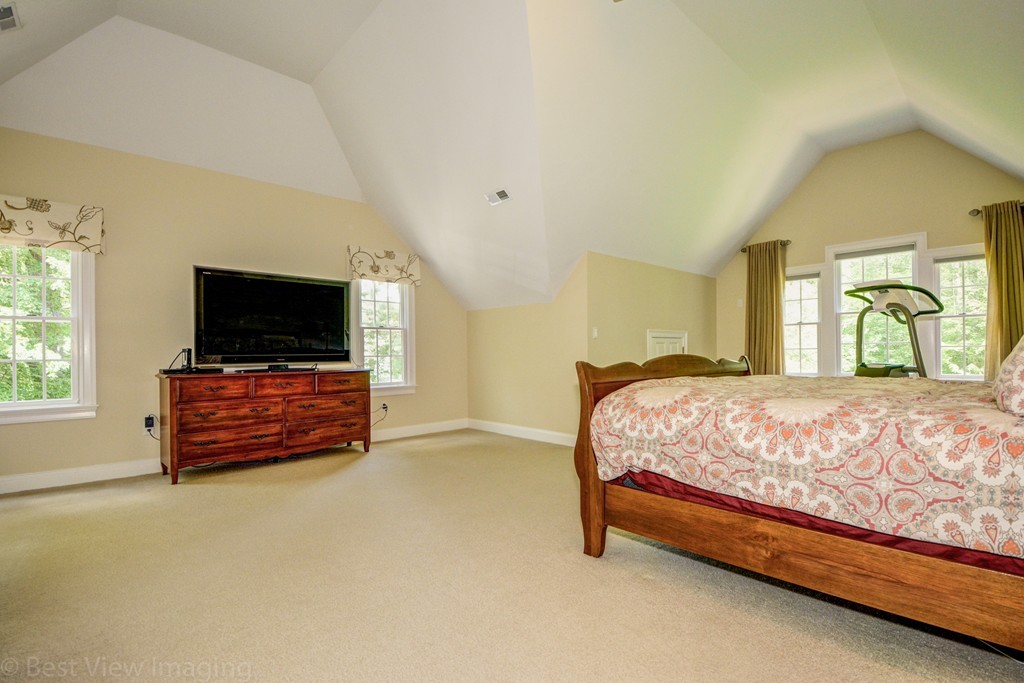 29 Prospect Street Upton, MA 01568 - Photo 22 of 30 a bedroom with a bed and a flat screen tv