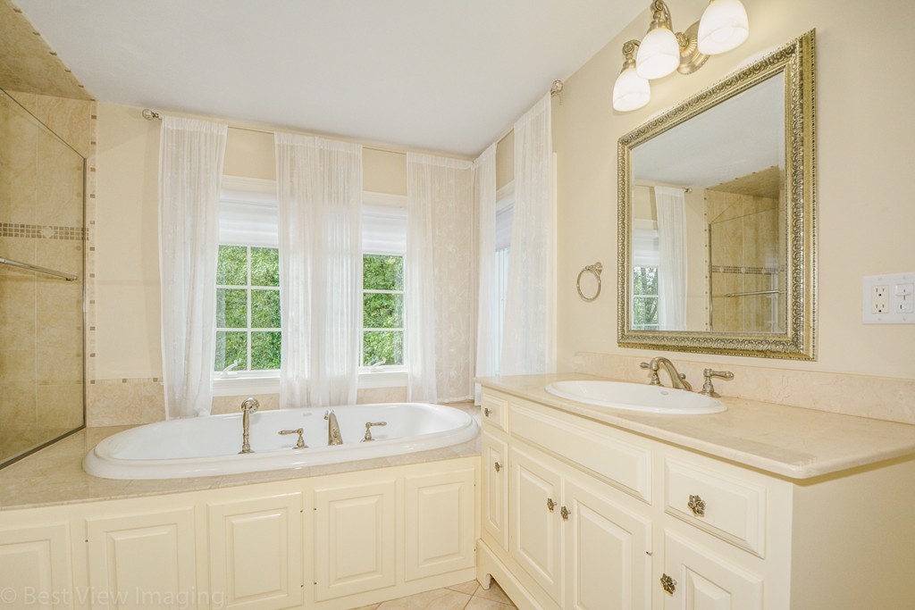 29 Prospect Street Upton, MA 01568 - Photo 24 of 30 a bathroom with a sink and a bathtub