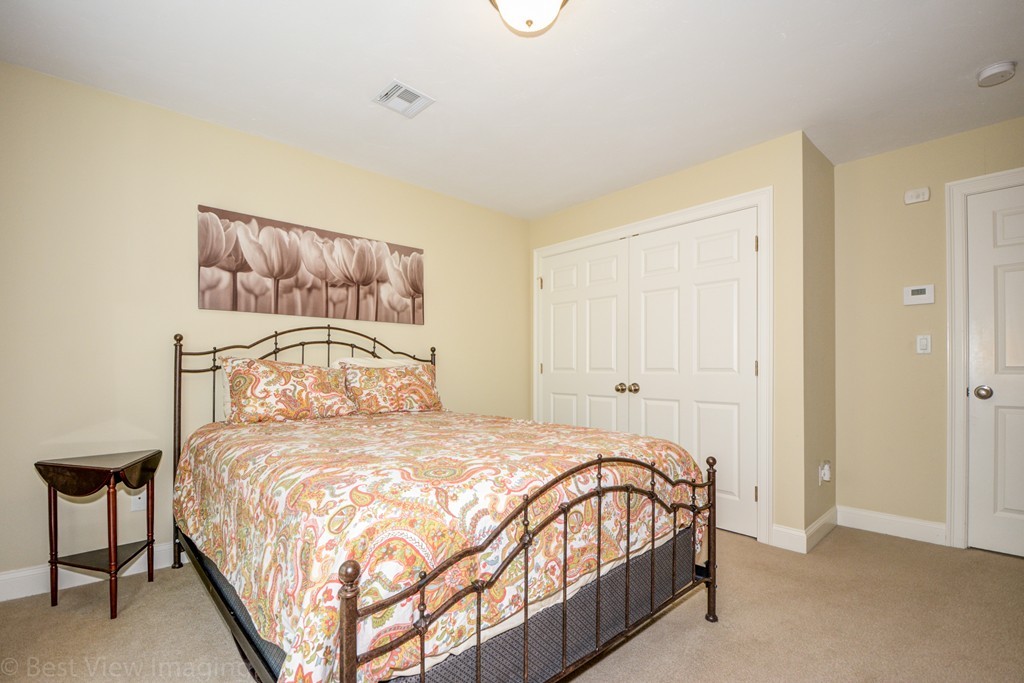 29 Prospect Street Upton, MA 01568 - Photo 27 of 30 a bedroom with a bed and a night stand