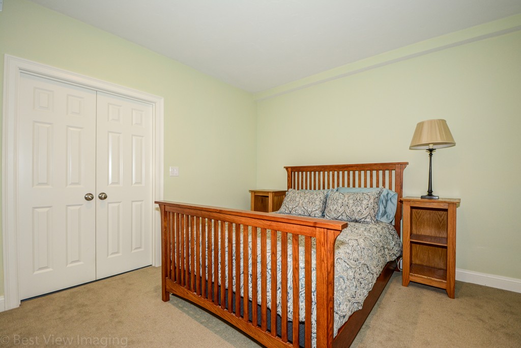 29 Prospect Street Upton, MA 01568 - Photo 30 of 30 a bedroom with a bed and a lamp