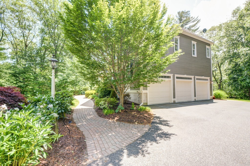 29 Prospect Street Upton, MA 01568 - Photo 4 of 30 a front view of a house with a yard and garage