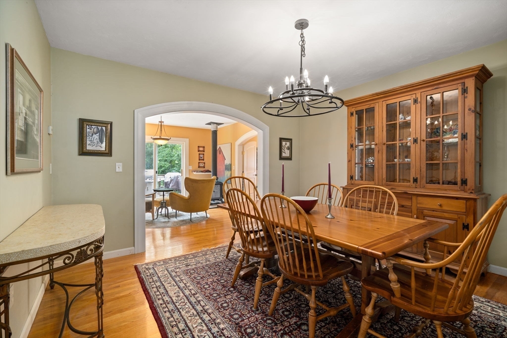 60 Easter Brook Road Lunenburg, MA 01462 - Photo 12 of 37 a dining room with furniture a chandelier and wooden floor