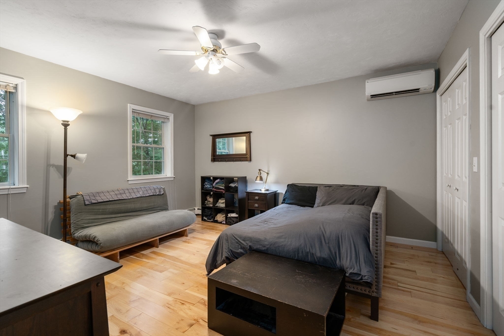 60 Easter Brook Road Lunenburg, MA 01462 - Photo 20 of 37 a bedroom with furniture and a wooden floor
