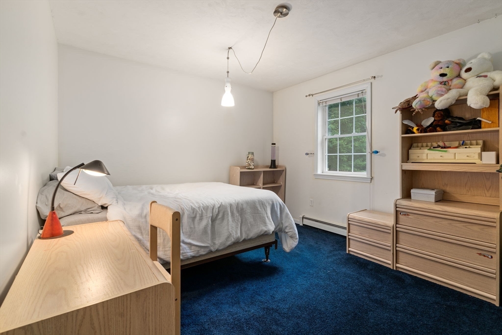 60 Easter Brook Road Lunenburg, MA 01462 - Photo 21 of 37 a bedroom with a bed and wooden floor