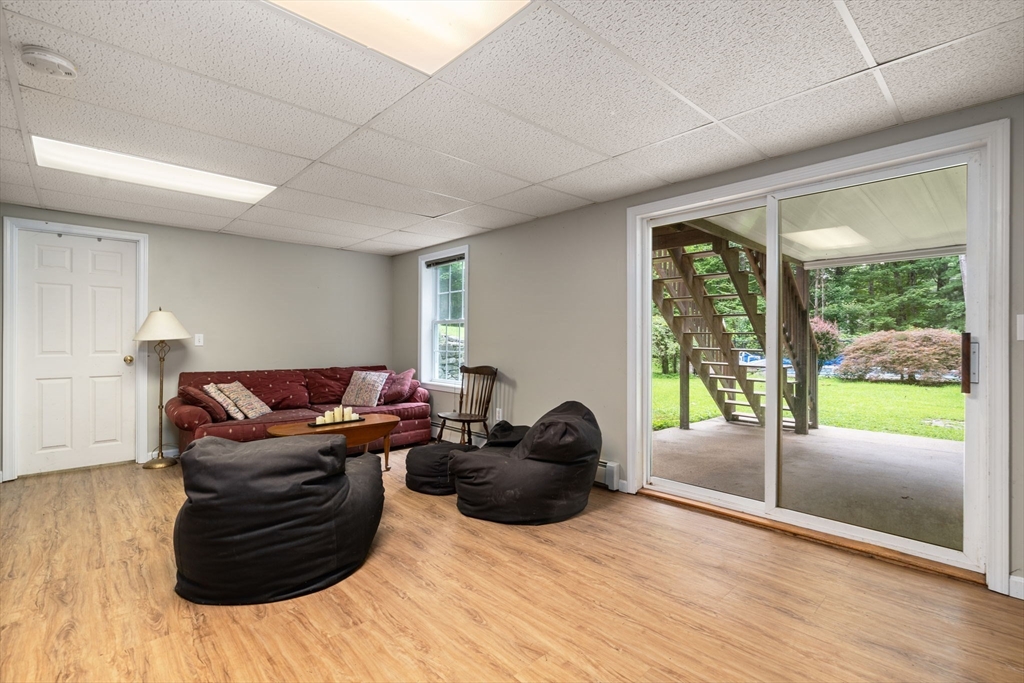 60 Easter Brook Road Lunenburg, MA 01462 - Photo 23 of 37 a living room with furniture tv and wooden floor