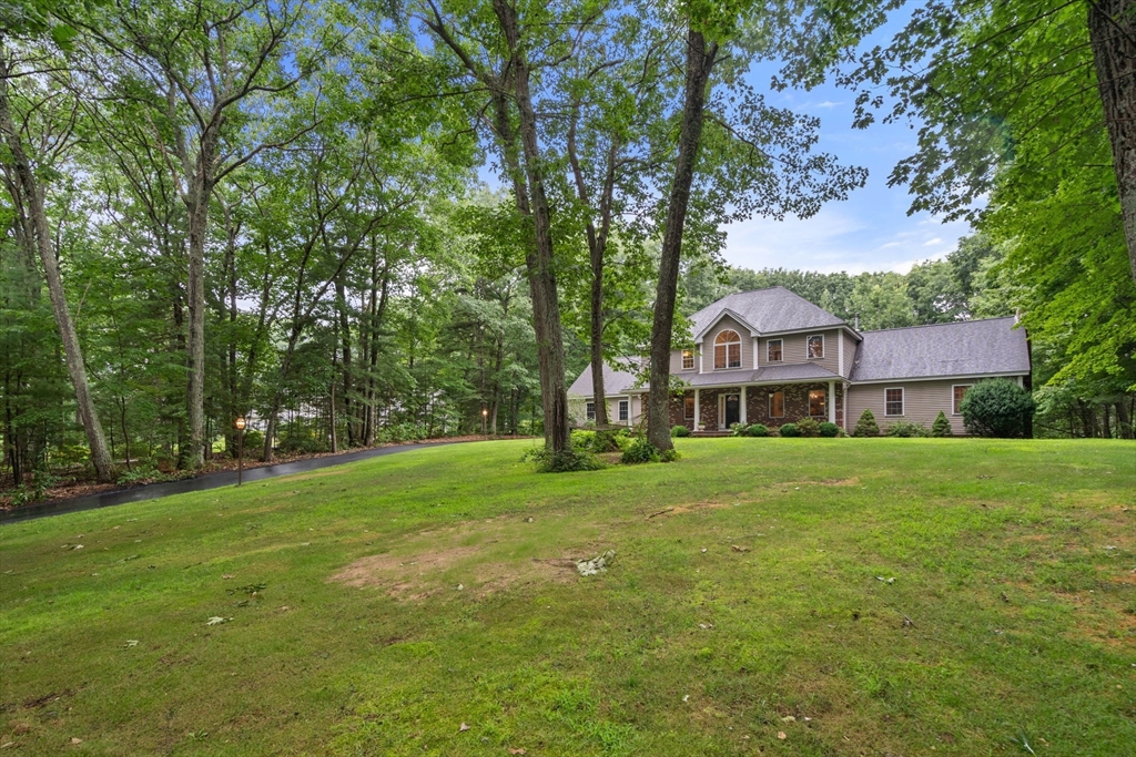 60 Easter Brook Road Lunenburg, MA 01462 - Photo 33 of 37 a front view of a house with garden