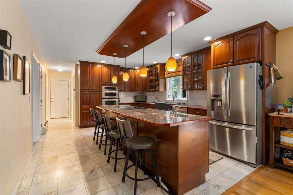60 Easter Brook Road Lunenburg, MA 01462 - Photo 4 of 37 a kitchen with stainless steel appliances granite countertop a refrigerator a stove and a sink