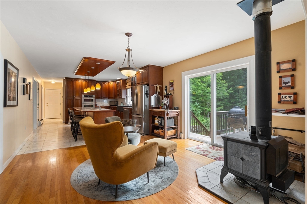 60 Easter Brook Road Lunenburg, MA 01462 - Photo 5 of 37 a living room with furniture and a floor to ceiling window