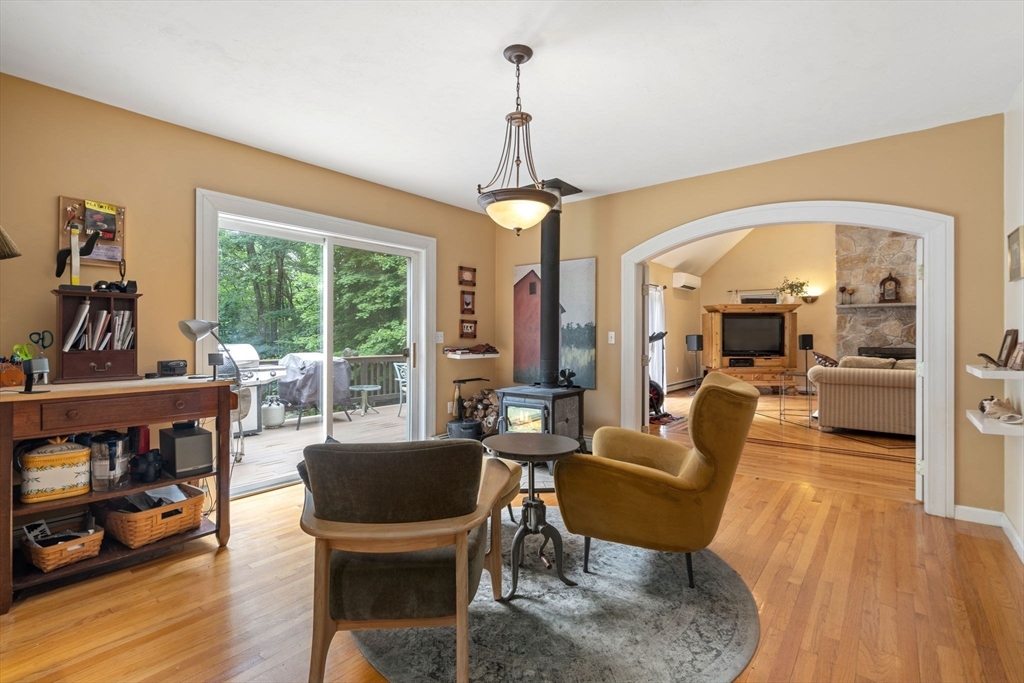 60 Easter Brook Road Lunenburg, MA 01462 - Photo 6 of 37 a living room with furniture a window and a chandelier