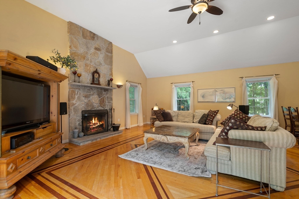 60 Easter Brook Road Lunenburg, MA 01462 - Photo 7 of 37 a living room with fireplace furniture and a flat screen tv