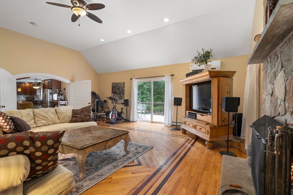 60 Easter Brook Road Lunenburg, MA 01462 - Photo 9 of 37 a living room with furniture and a flat screen tv