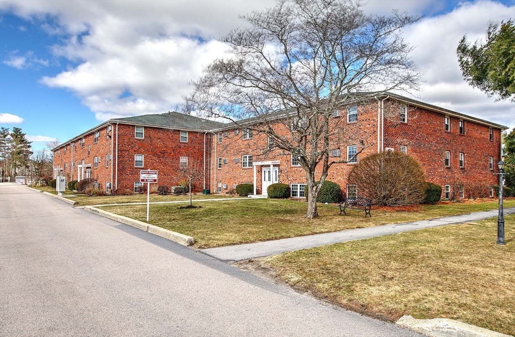 91 Pleasant Street, Unit A6 Medfield, MA 02052 - Photo 2 of 29 a view of a house with a yard