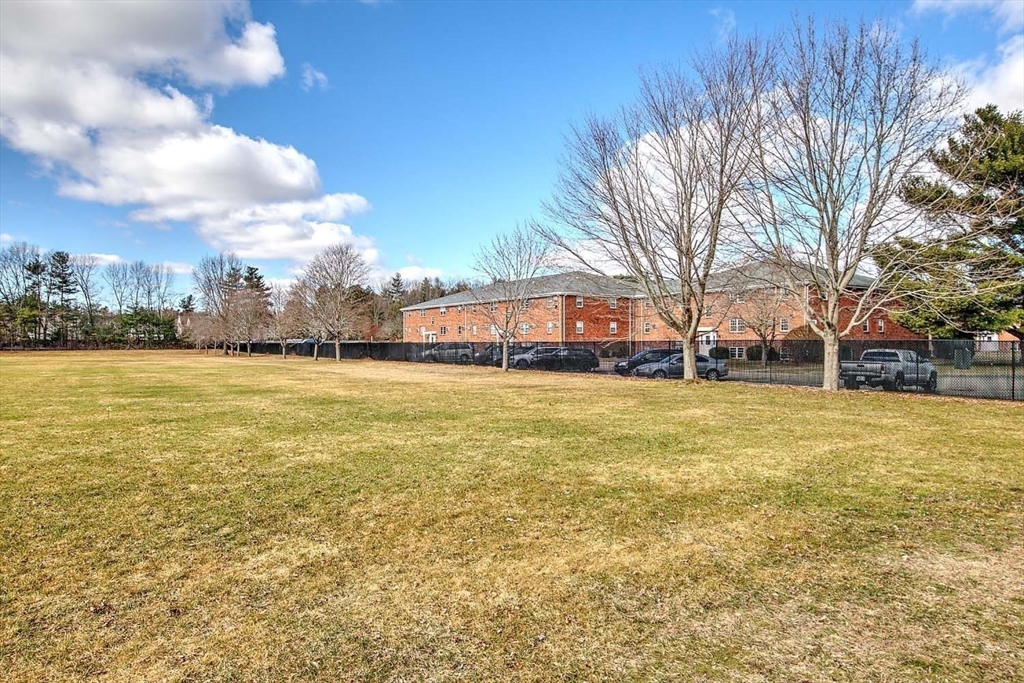 91 Pleasant Street, Unit A6 Medfield, MA 02052 - Photo 25 of 29 a view of swimming pool with an outdoor space and seating area