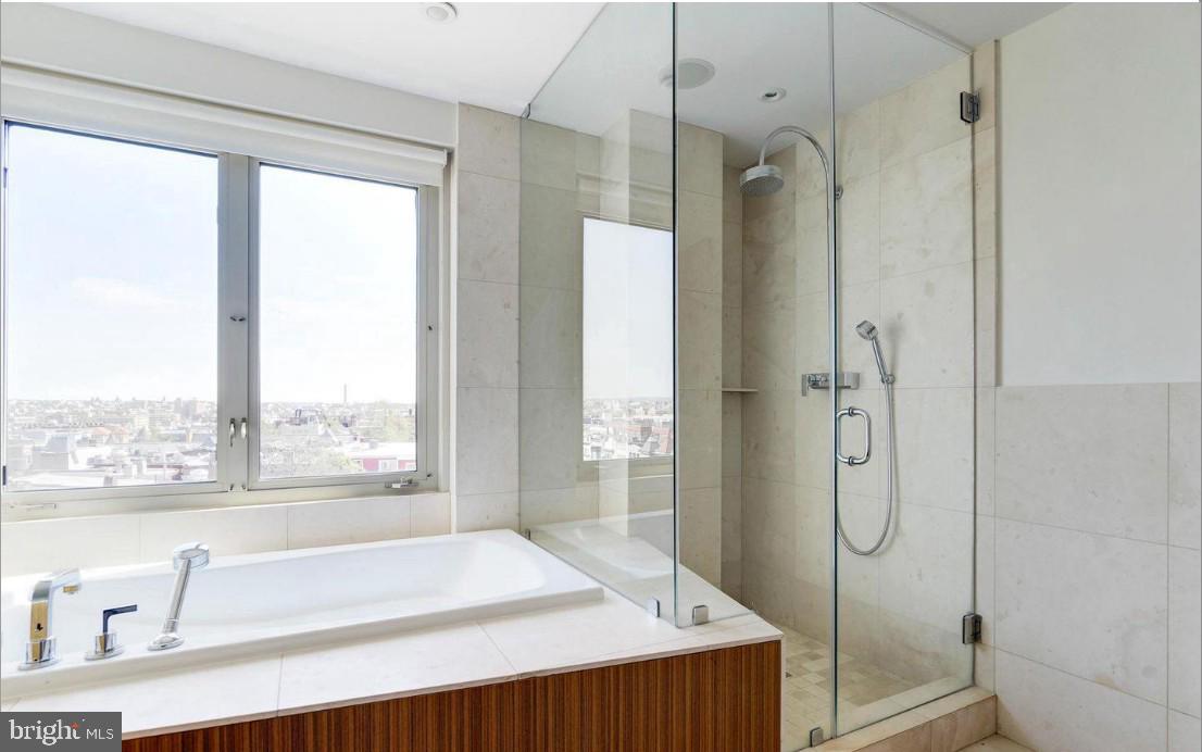 2424 18th Street Northwest, Unit R4 Washington, DC 20009 - Photo 26 of 40 a bathroom with a granite countertop shower and a sink