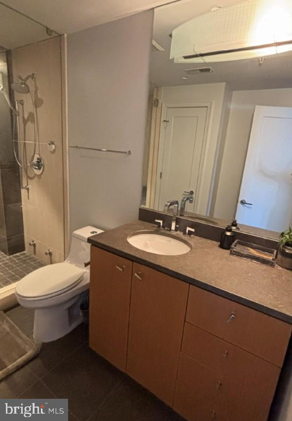 2424 18th Street Northwest, Unit R4 Washington, DC 20009 - Photo 28 of 40 a bathroom with a double vanity sink toilet and a mirror