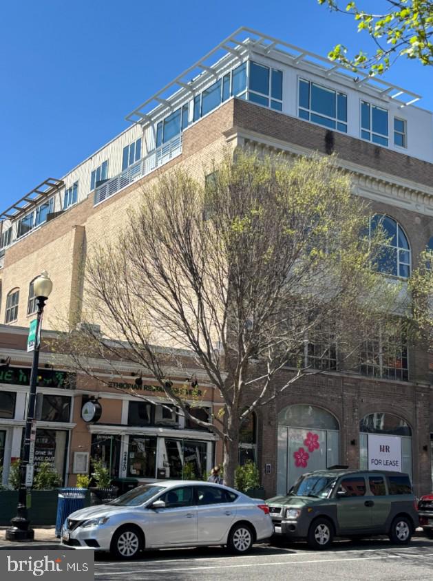 2424 18th Street Northwest, Unit R4 Washington, DC 20009 - Photo 38 of 40 a car parked in front of a building