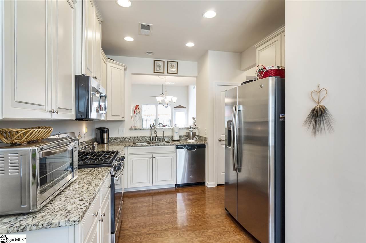 Granite Counters- Stainless Appliances- Off White Cabinets