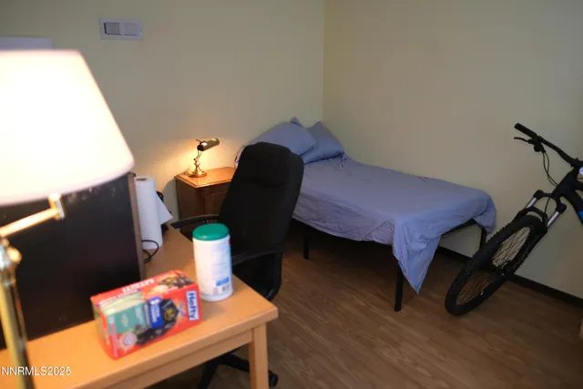 a bedroom with furniture and a window