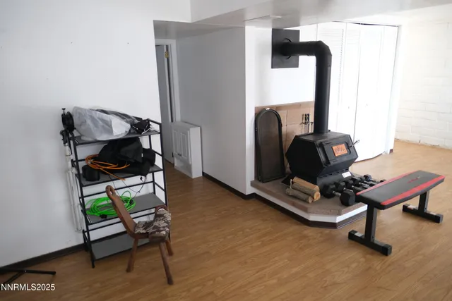 a living room with furniture and gym equipment