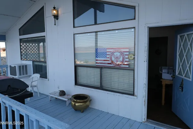 a view of a livingroom with furniture and window