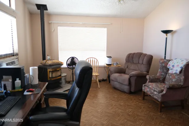 a work room with furniture and a window