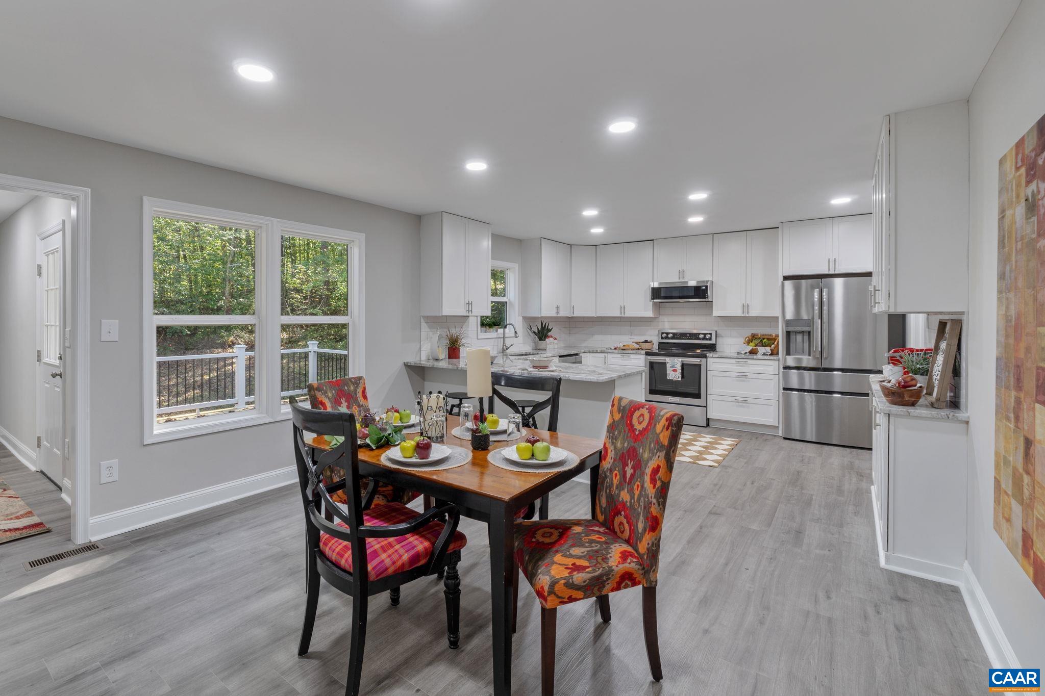 612 Oneals Road Pratts, VA 22731 - Photo 11 of 68 a view of a dining room with furniture and wooden floor