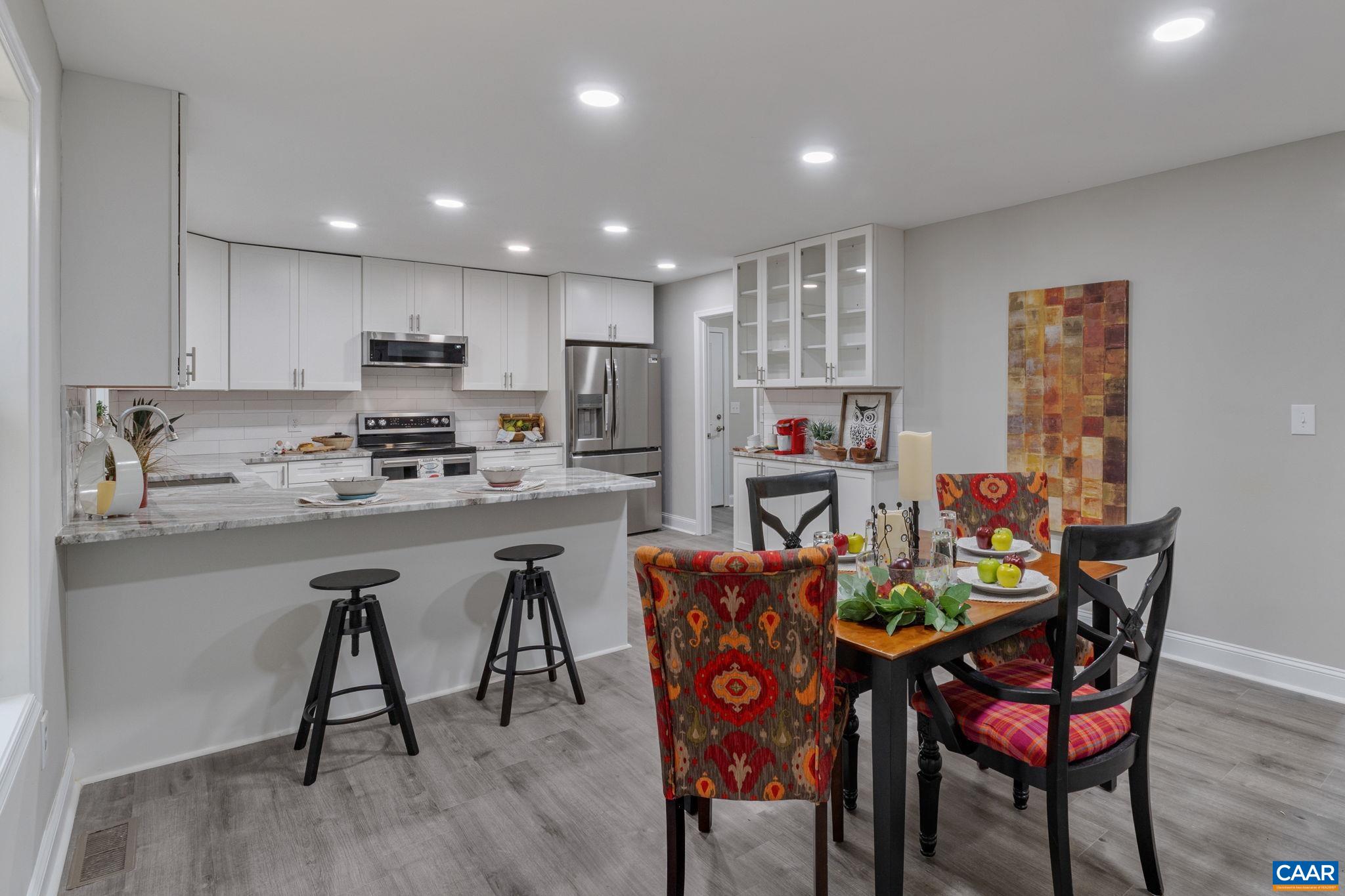 612 Oneals Road Pratts, VA 22731 - Photo 12 of 68 a view of a dining room with furniture and wooden floor