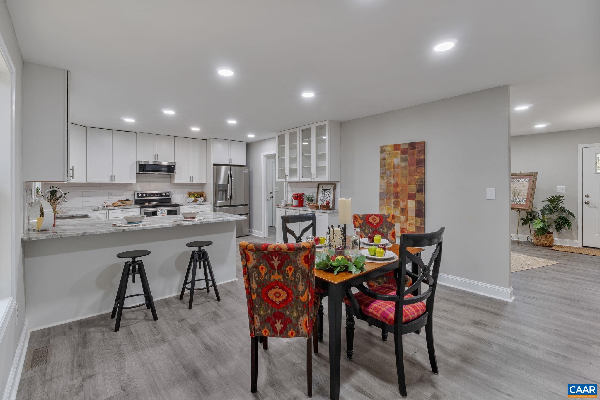 612 Oneals Road Pratts, VA 22731 - Photo 13 of 68 a view of a dining room with furniture and wooden floor