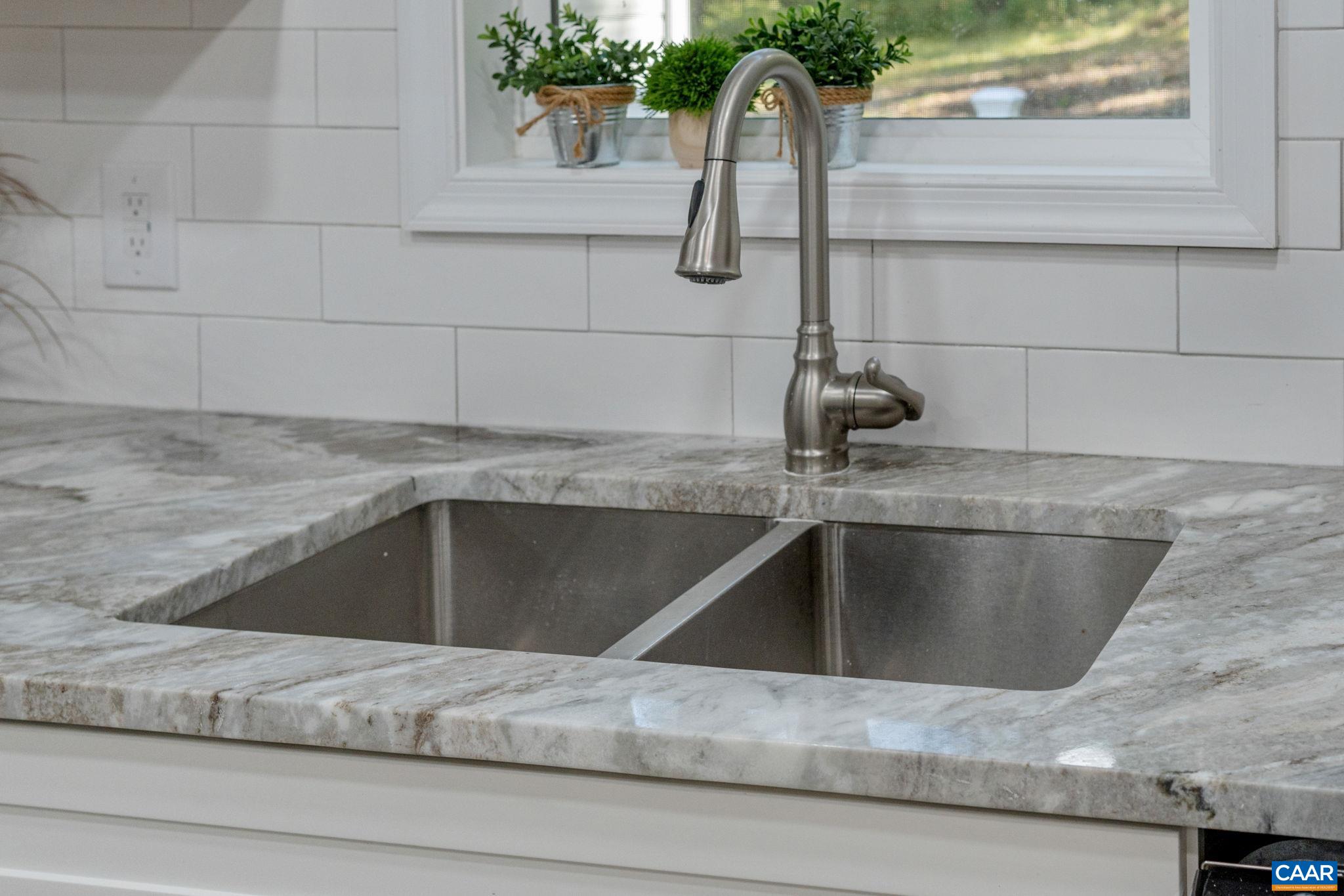 612 Oneals Road Pratts, VA 22731 - Photo 16 of 68 a kitchen with a sink and granite counter top