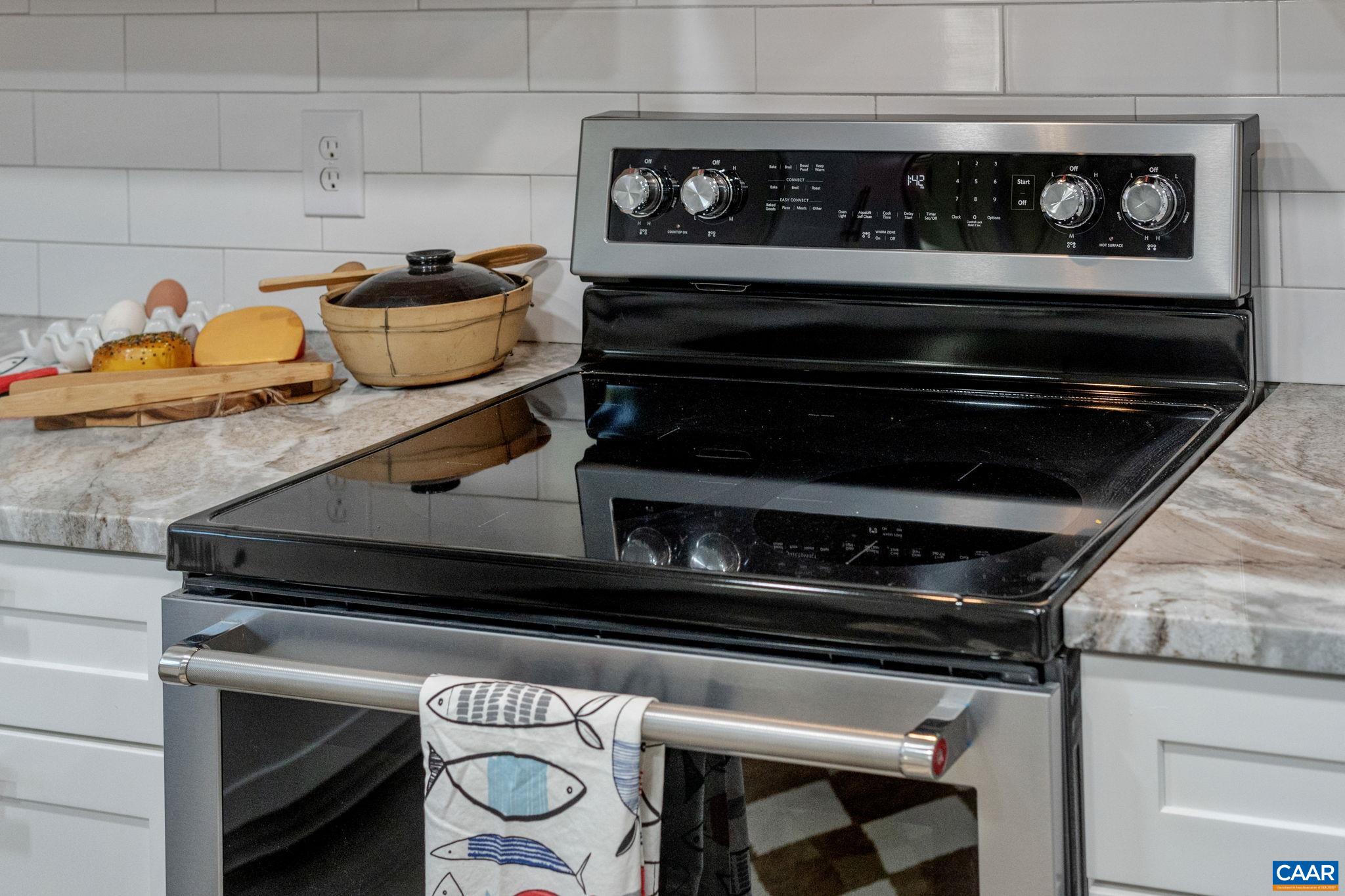 612 Oneals Road Pratts, VA 22731 - Photo 18 of 68 a stove top oven sitting inside of a kitchen