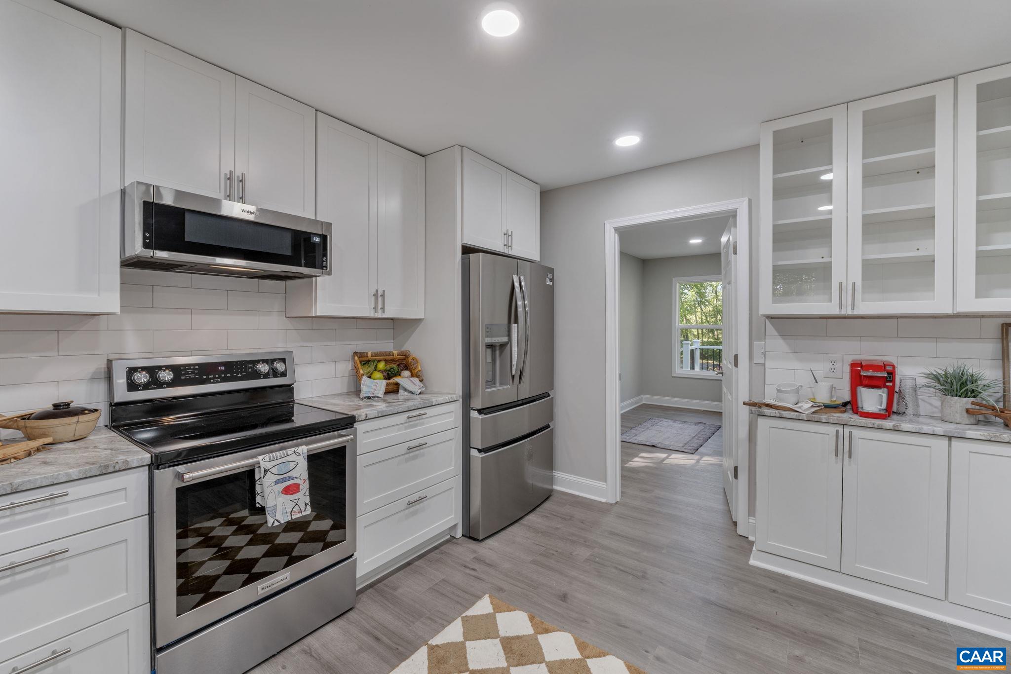 612 Oneals Road Pratts, VA 22731 - Photo 20 of 68 a kitchen with stainless steel appliances a stove a refrigerator and cabinets