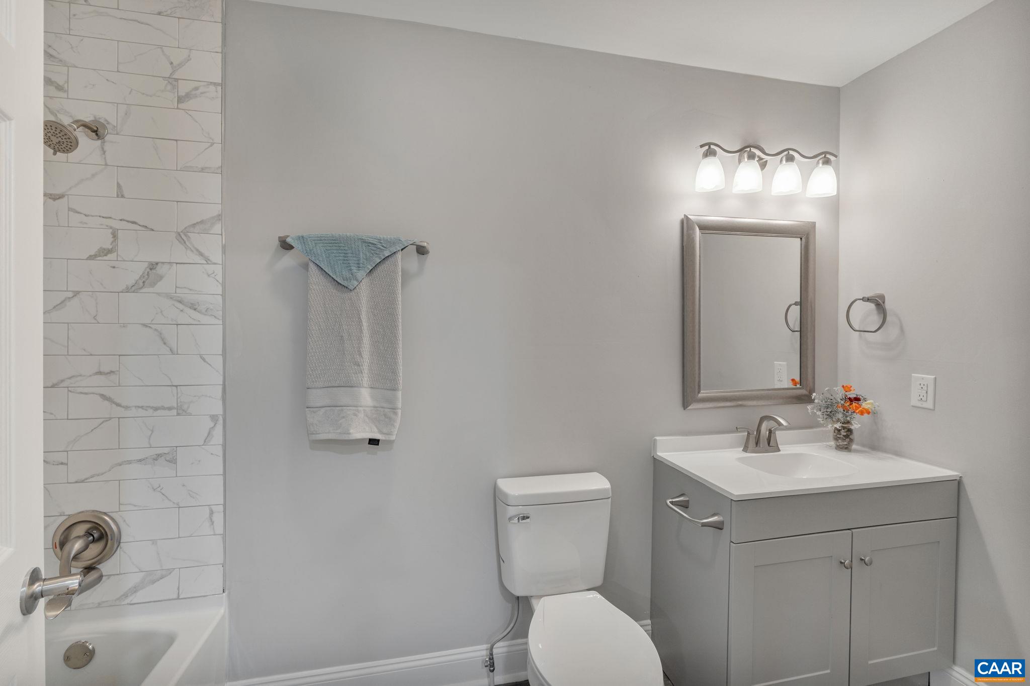 612 Oneals Road Pratts, VA 22731 - Photo 22 of 68 a bathroom with a sink toilet and shower