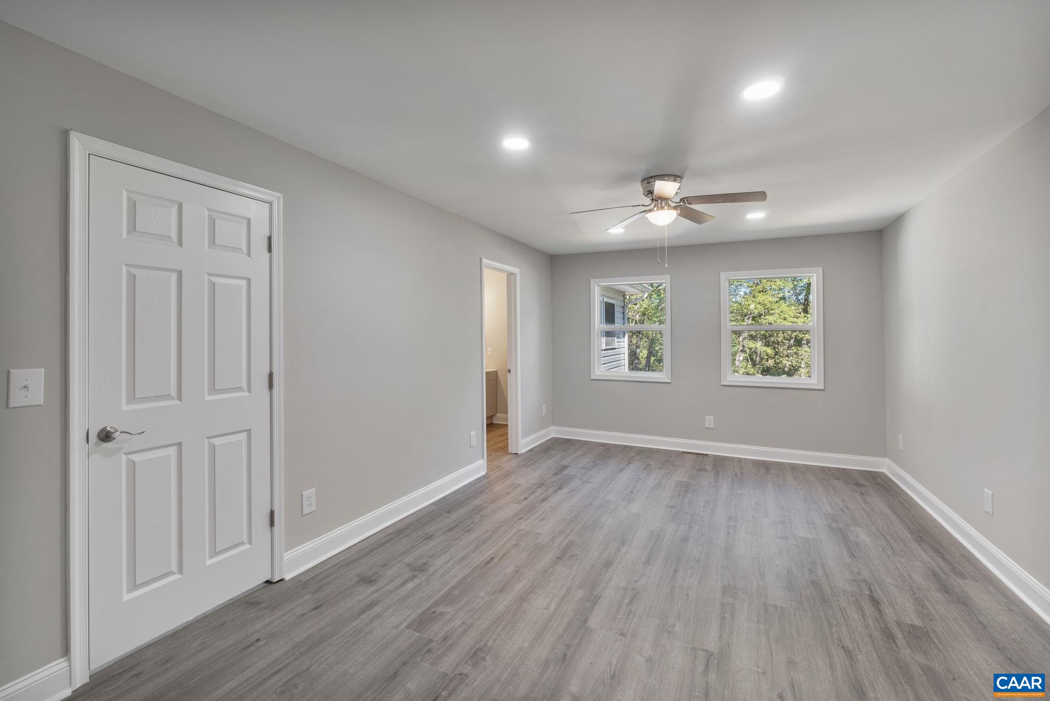 612 Oneals Road Pratts, VA 22731 - Photo 23 of 68 wooden floor in an empty room with a window