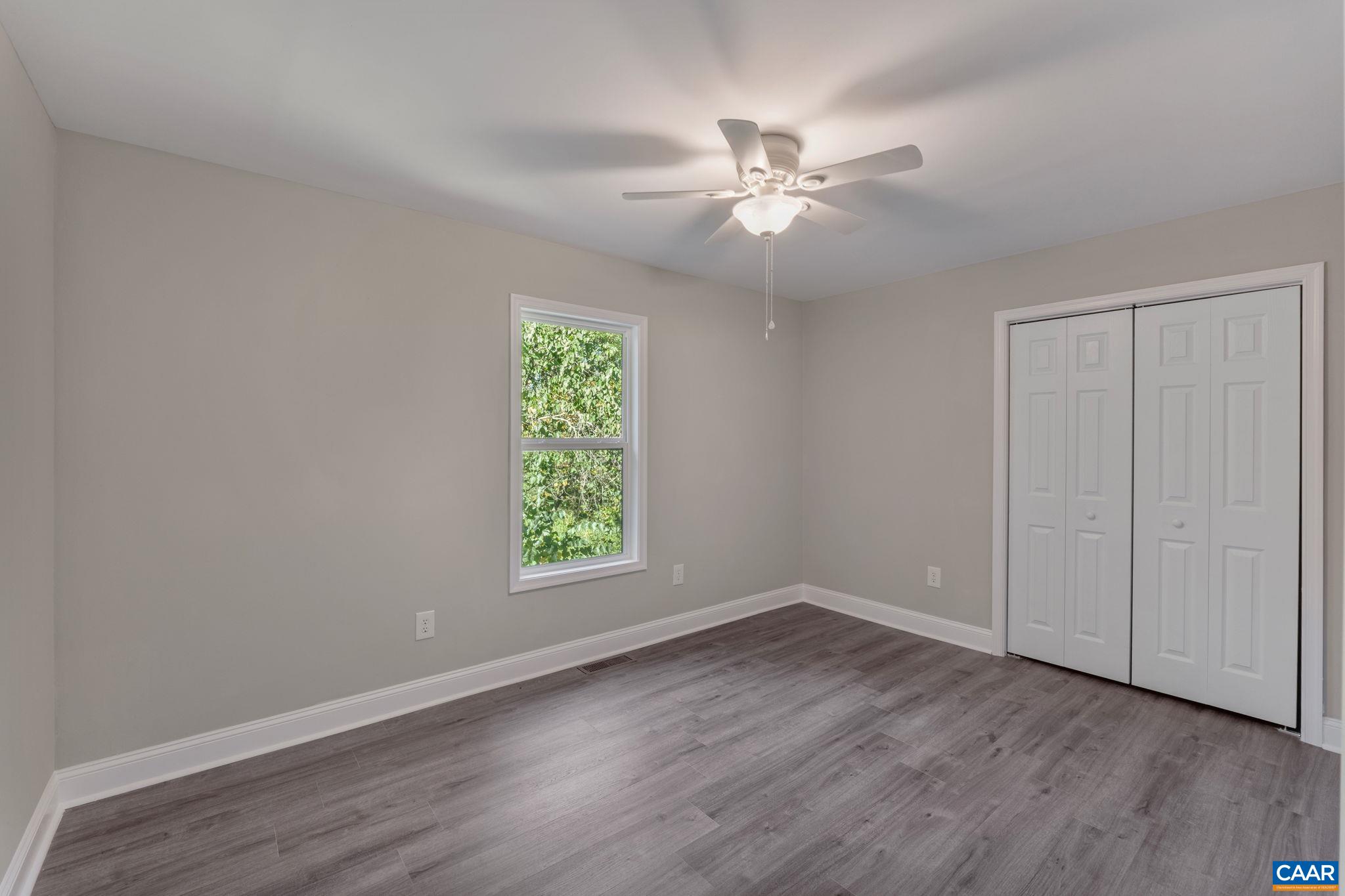 612 Oneals Road Pratts, VA 22731 - Photo 24 of 68 wooden floor in an empty room with a window