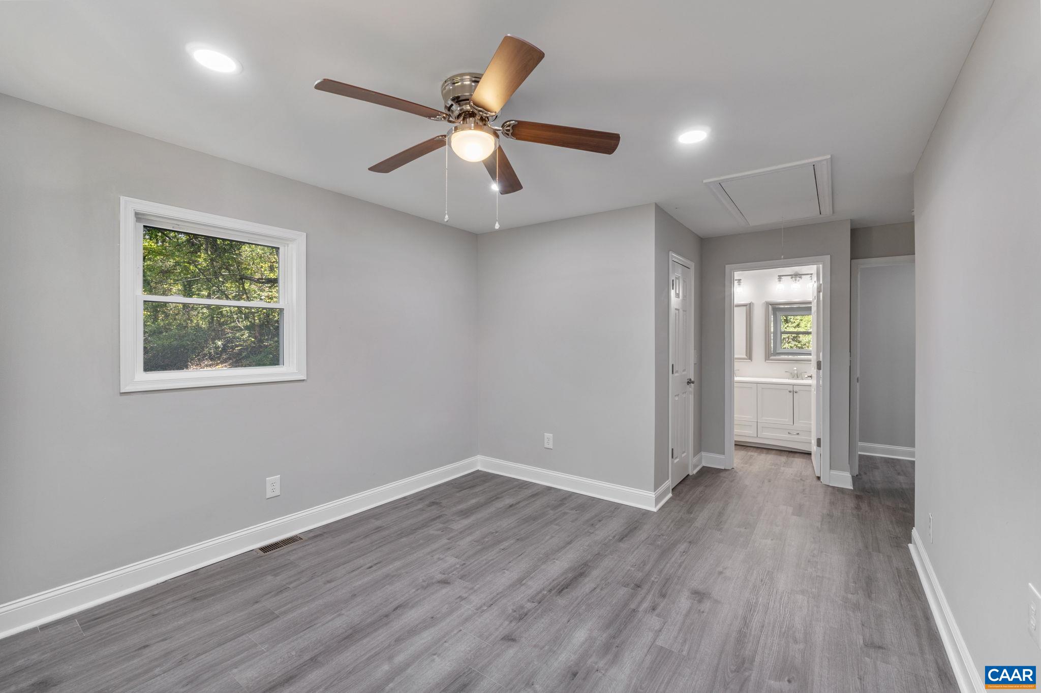612 Oneals Road Pratts, VA 22731 - Photo 26 of 68 a view of an empty room with wooden floor and a window