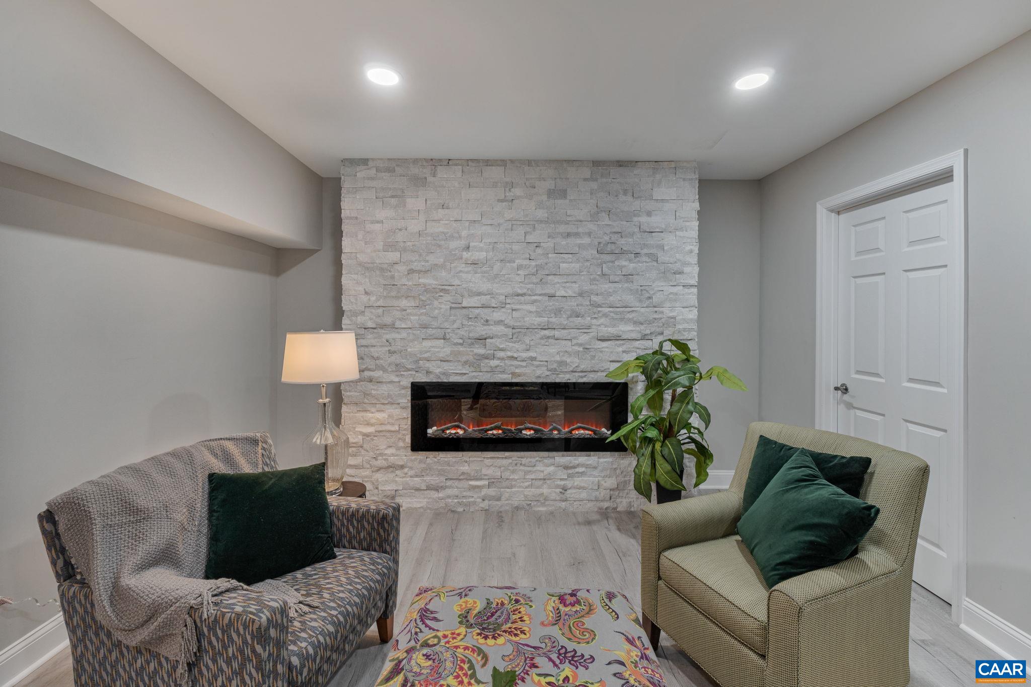 612 Oneals Road Pratts, VA 22731 - Photo 27 of 68 a living room with furniture and a fireplace