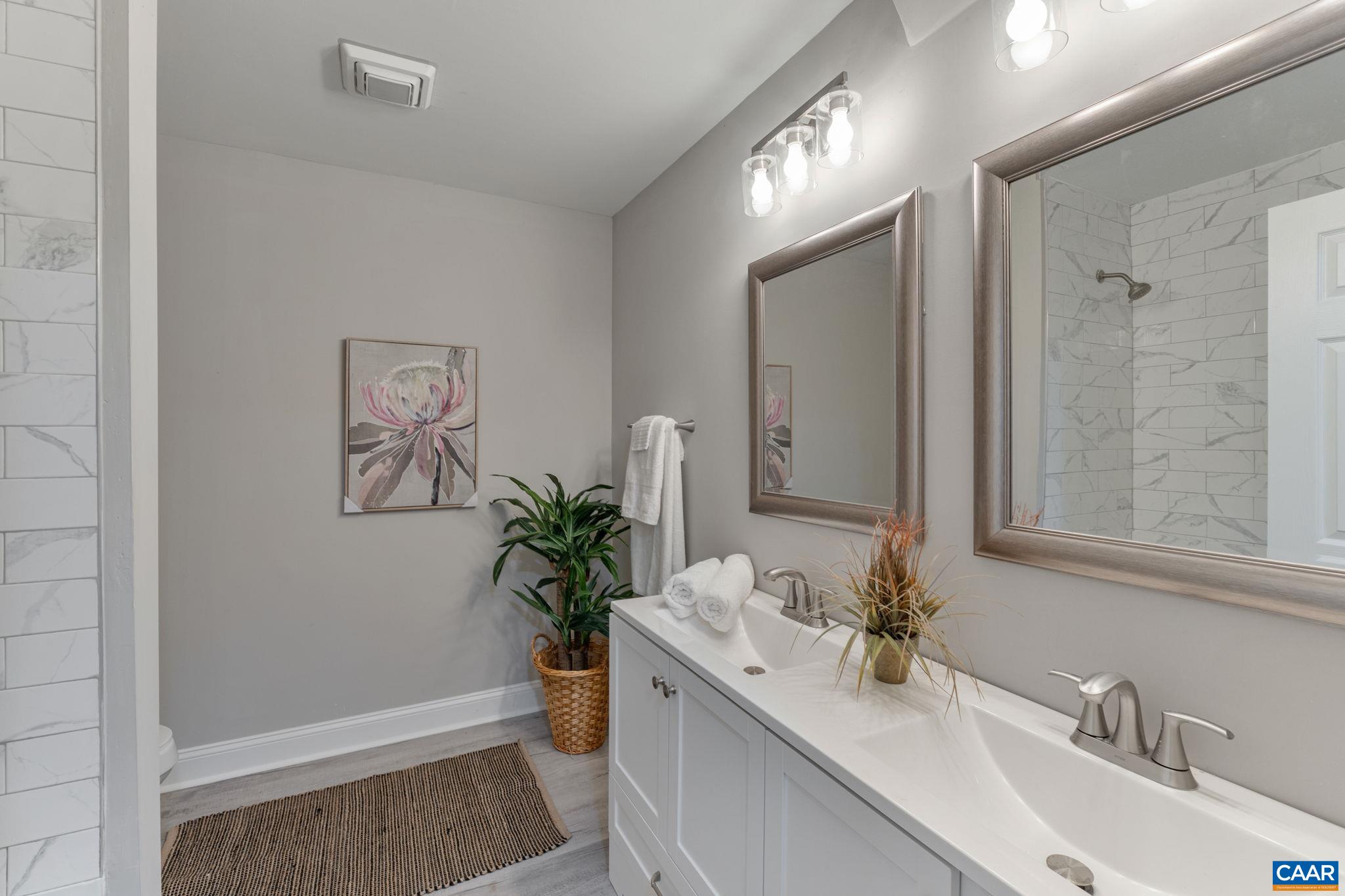 612 Oneals Road Pratts, VA 22731 - Photo 33 of 68 a bathroom with a sink a toilet and a mirror