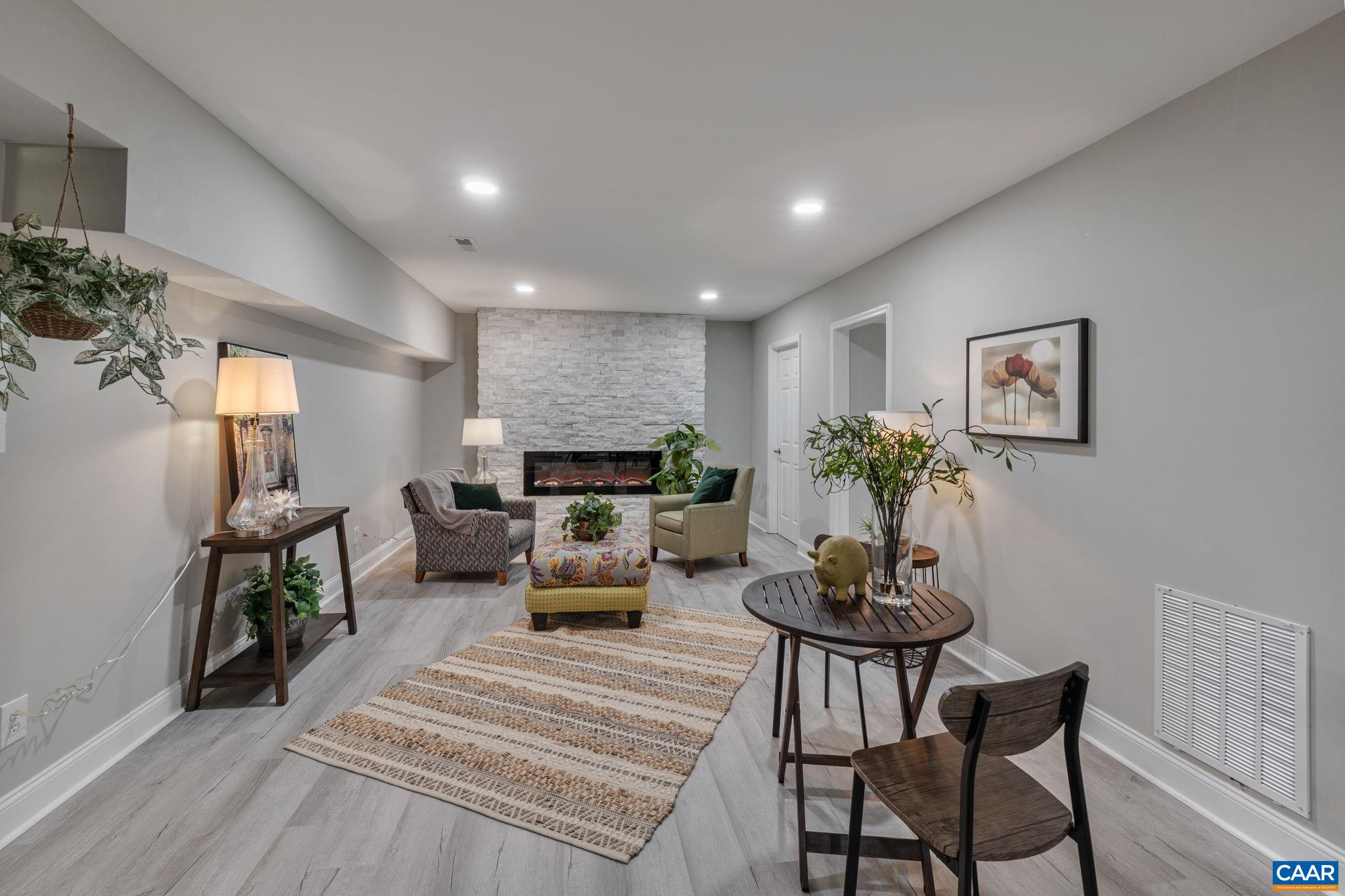 612 Oneals Road Pratts, VA 22731 - Photo 38 of 68 a living room with furniture and a potted plant