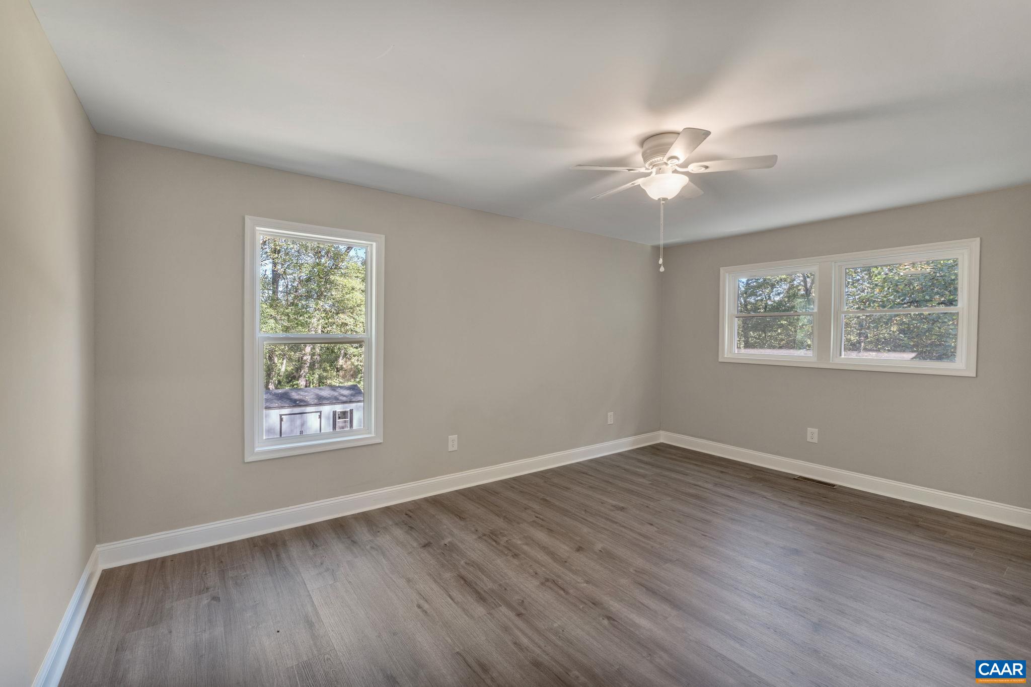 612 Oneals Road Pratts, VA 22731 - Photo 46 of 68 a view of an empty room with a window and wooden floor