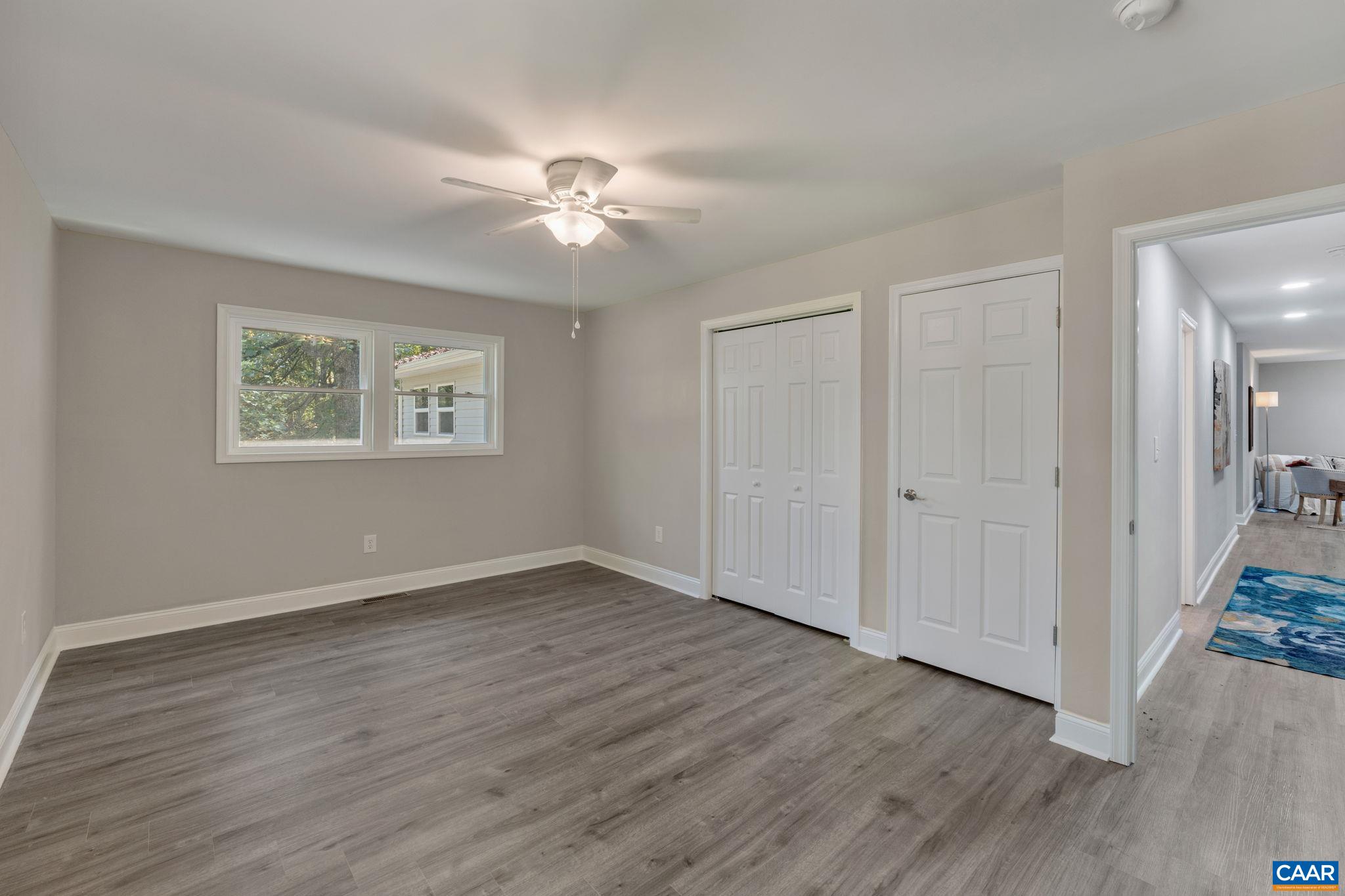 612 Oneals Road Pratts, VA 22731 - Photo 47 of 68 a view of an empty room with wooden floor and a window