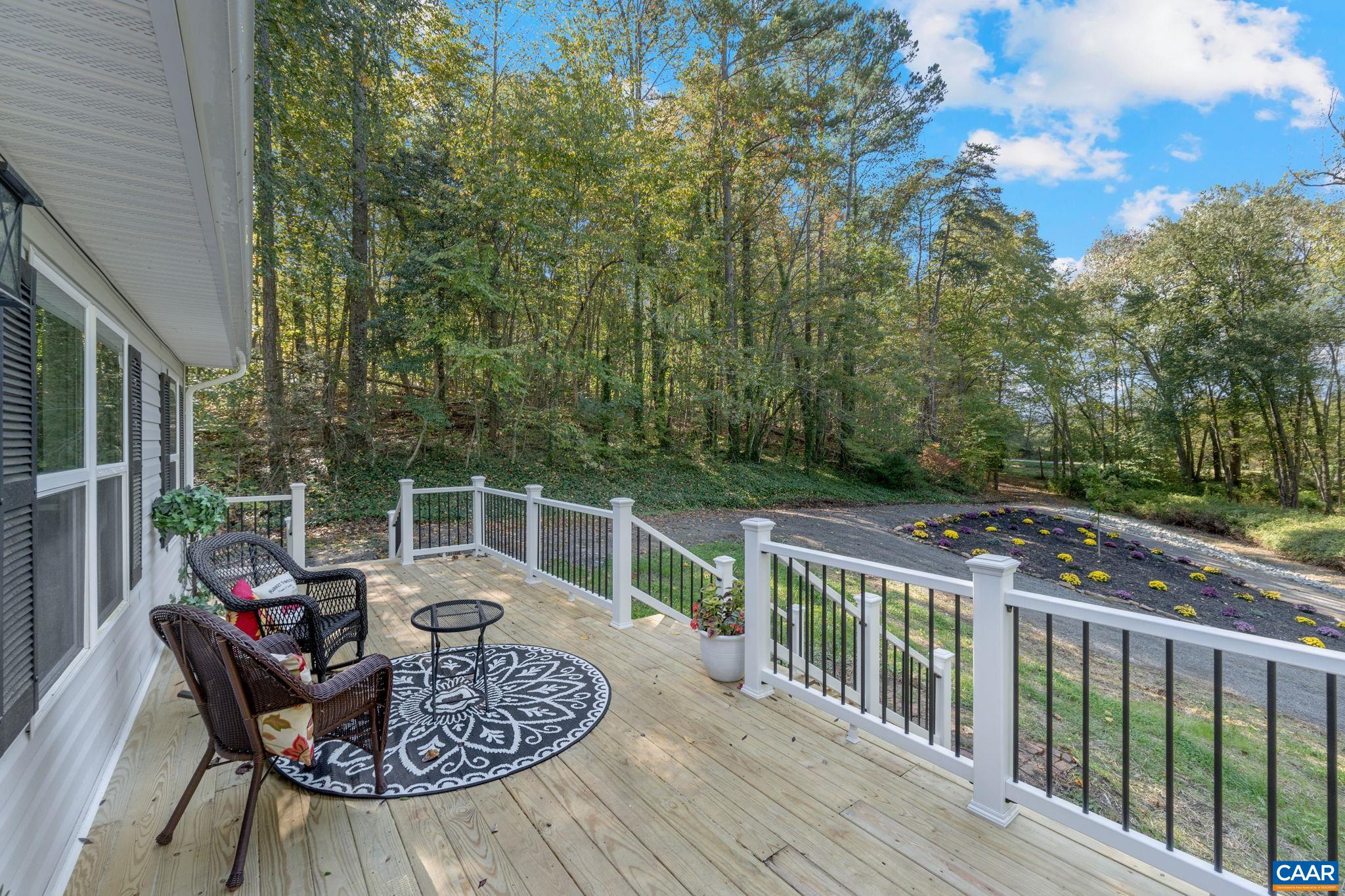 612 Oneals Road Pratts, VA 22731 - Photo 57 of 68 a view of balcony with furniture and garden