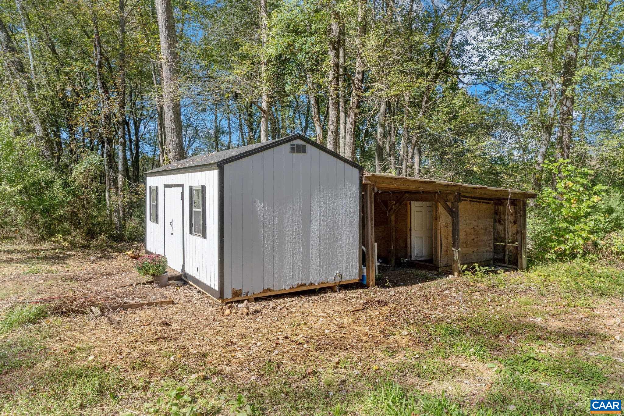 612 Oneals Road Pratts, VA 22731 - Photo 61 of 68 a view of a house with a yard and garage