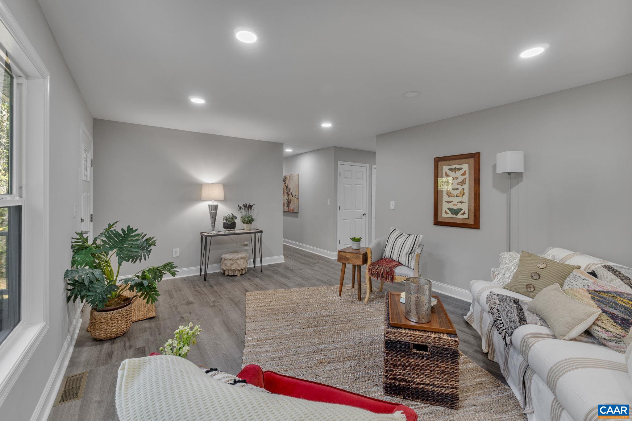 612 Oneals Road Pratts, VA 22731 - Photo 7 of 68 a living room with furniture and flowers