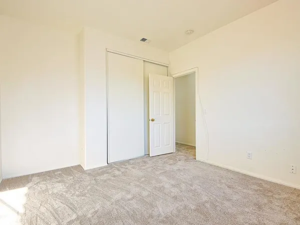 a spacious bathroom with a granite countertop sink mirror and a