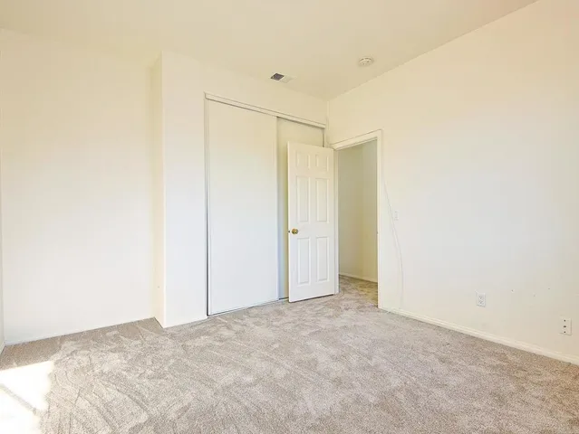 a spacious bathroom with a granite countertop sink mirror and a