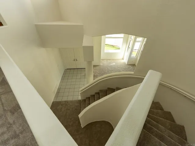 a view of living room with furniture and entryway